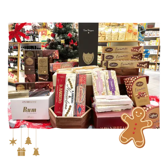 Selezione di torrone, cioccolato e Panettone accostata a una bottiglia di Dom Pérignon per una degustazione.